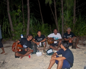 AAII-crew_-Dive-guide-Made-on-left-playing-guitar